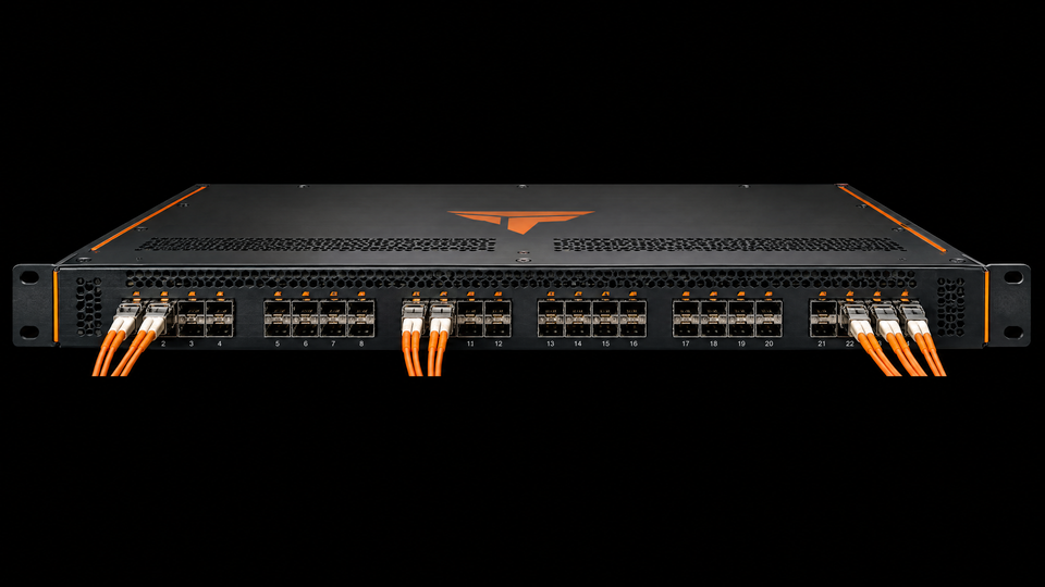 A rack network switch with original orange fiber-optic accents.